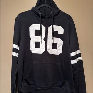 Black and White Sweatshirt with Bold Number and Stripes